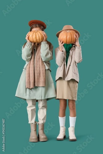 Cute girls in autumn clothe...
