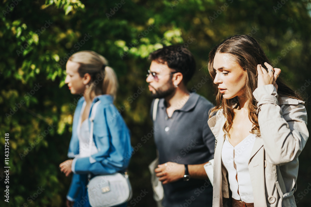 A group of three friends enjoying a casual day outdoors, immersed in a natural setting. They appear relaxed and engaged in their surroundings, capturing the essence of friendship and leisure. A group of three friends enjoying a casual day outdoors, immersed in a natural setting. They appear relaxed and engaged in their surroundings, capturing the essence of friendship and leisure.