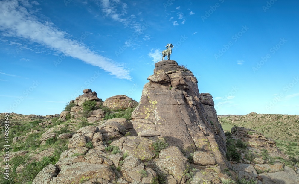 Fototapeta premium Scenic stone forest landscape in Jimustai, Inner Mongolia showcasing towering rock formations and clear blue skies
