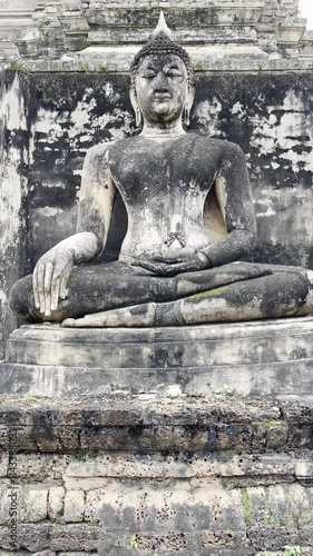 Sukhothai art Buddha statue at Wat Phra Si Rattana Mahathat Chaliang, Sukhothai, Buddha statue in the Mara-Vijaya attitude and Walking Buddha statue at Si Satchanalai Historical Park