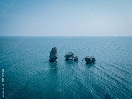 Bohai Bay Dongdaihe summer seaside scenery with serene waters and rocky formations photo