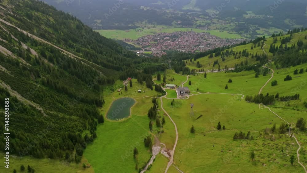 Aerial view Nebelhorn snowmaking pond in Oberstdorf collects water for artificial snow, supporting skiing activities despite variable natural snowfall. Supporting sustainable snow coverage in Alps. Aerial view Nebelhorn snowmaking pond in Oberstdorf collects water for artificial snow, supporting skiing activities despite variable natural snowfall. Supporting sustainable snow coverage in Alps.