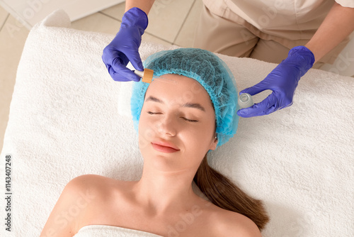 Cosmetologist applying cosm...