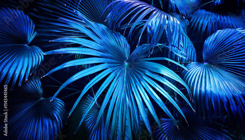 Creative fluorescent color layout made of tropical leaves. Flat lay neon colors. Nature concept.