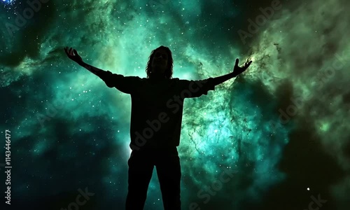 Wallpaper Mural A silhouette of a person with outstretched arms against a vibrant cosmic background filled with stars. Torontodigital.ca