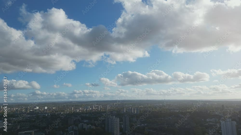 Bird’s eye view of London under fluffy clouds. Bird’s eye view of London under fluffy clouds.