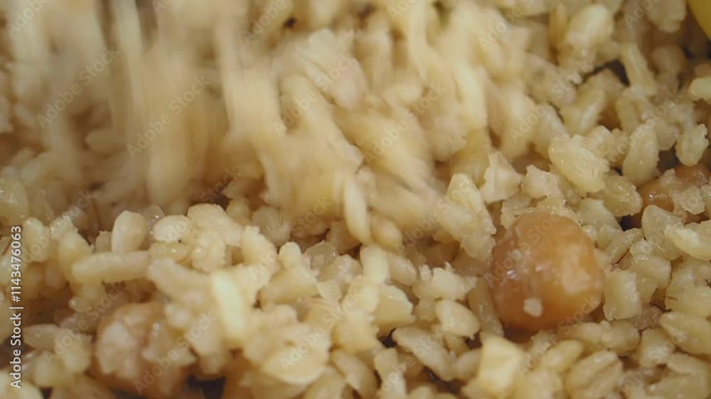 A CloseUp Shot of Flavorful Brown Rice Served with Fresh Vegetables A CloseUp Shot of Flavorful Brown Rice Served with Fresh Vegetables