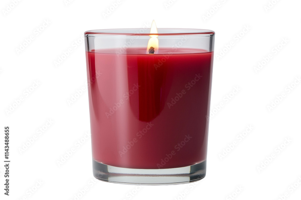 A red candle is lit in a clear glass A red candle is lit in a clear glass