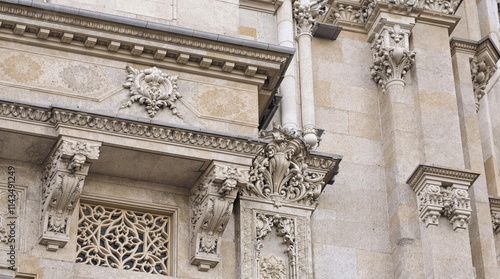 Intricately carved classical stone facade details
 photo