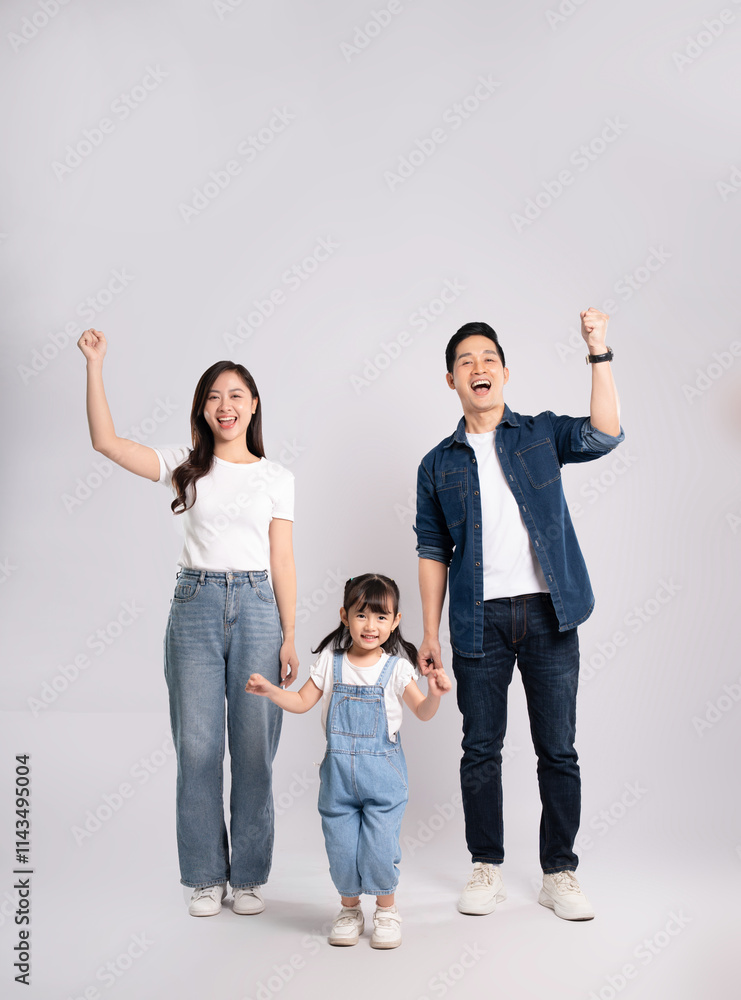 Fototapeta premium full body of a happy asian family posing on a white background