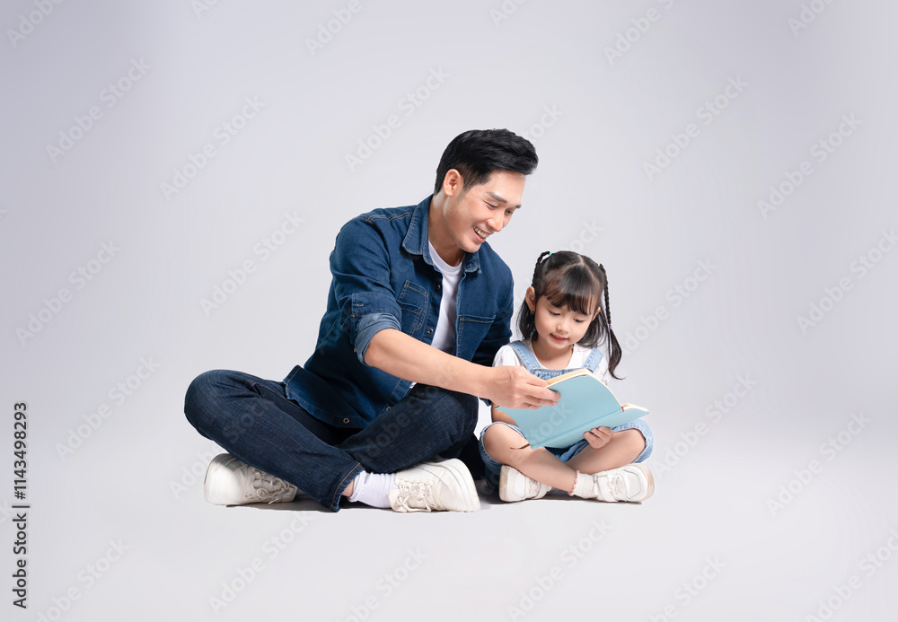 Full body image of Asian father and daughter posing on white background Full body image of Asian father and daughter posing on white background