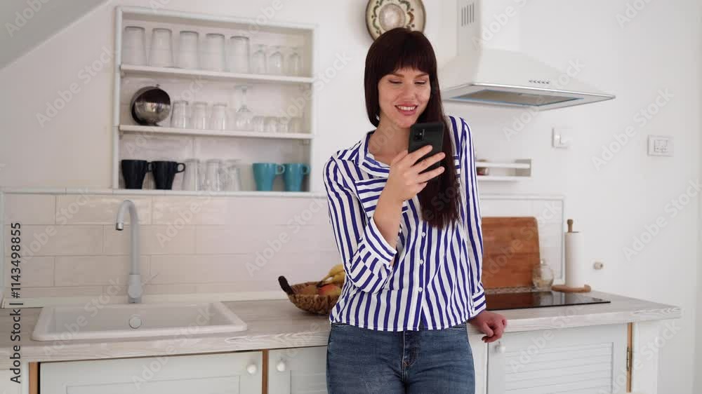 Young woman texting on smartphone at home Young woman texting on smartphone at home