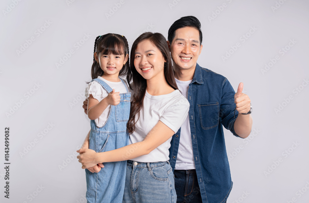 Fototapeta premium portrait of a happy asian family posing on a white background