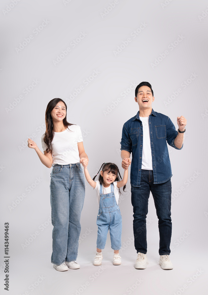 Full body image of Asian mother and daughter posing on white background Full body image of Asian mother and daughter posing on white background