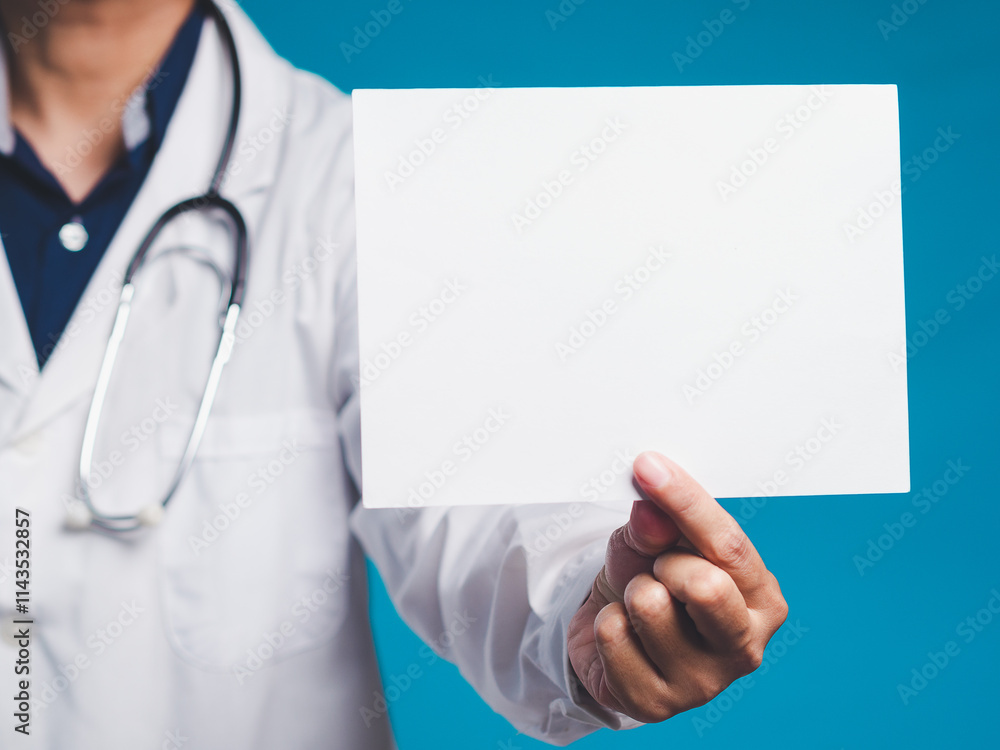 Doctor in white coat holding a blank paper sheet, blue background. Doctor in white coat holding a blank paper sheet, blue background.