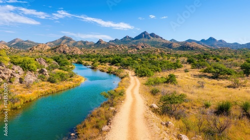 Scenic River and Serene Pathway in a Majestic Mountain Landscape