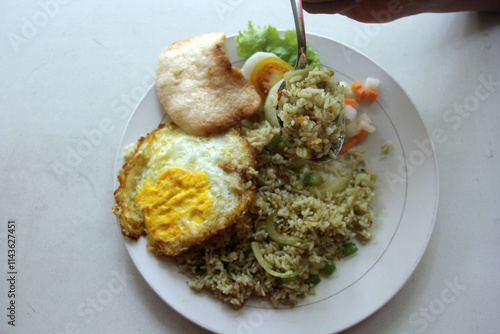 omelet with green fried rice photo