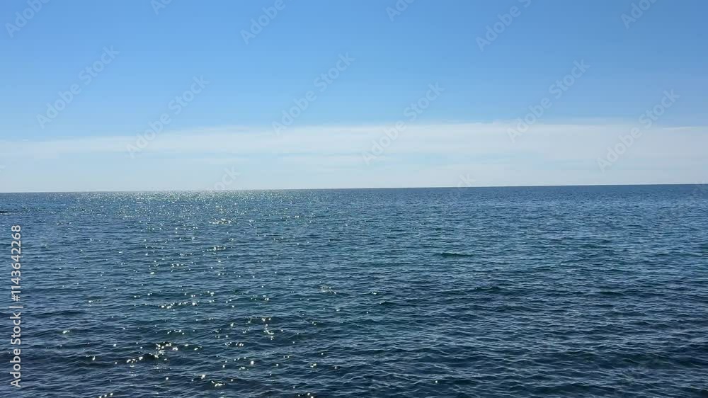 Open sea blue calm water and cloudless sky. Open sea blue calm water and cloudless sky.