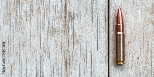 civil war rebellion concept. A close-up of a bullet resting on a wooden surface, highlighting its metallic casing and pointed tip against a textured background. photo