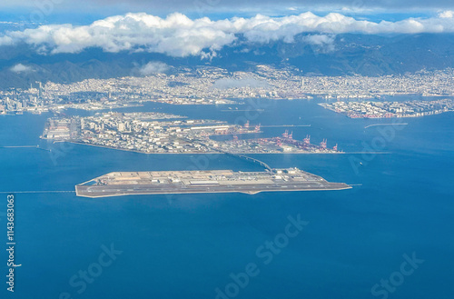 Aerial view of the Kansai International Airport (KIX) with izumisano city in background. photo