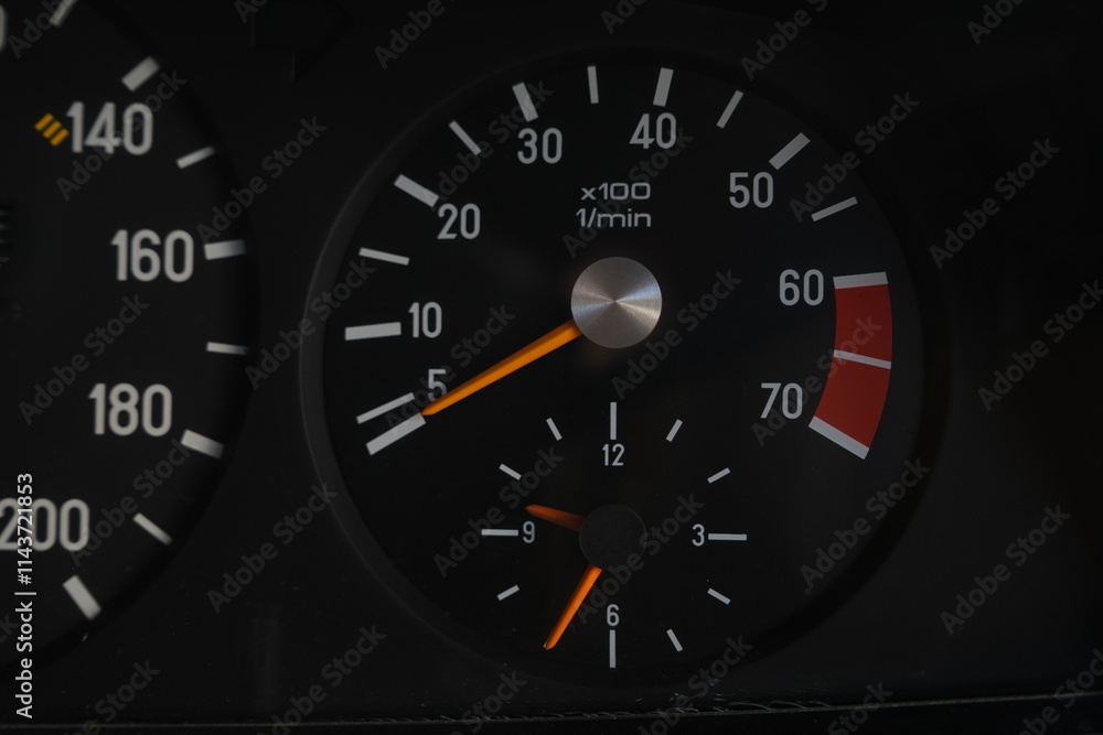 Analog speedometer in an internal combustion engine car at an auto show in Bangkok, Thailand, photographed on December 8, 2014. Analog speedometer in an internal combustion engine car at an auto show in Bangkok, Thailand, photographed on December 8, 2014.