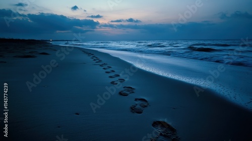 Footprints in the sand at a tranquil beach during twilight, capturing the beauty of dusk and the rhythmic waves