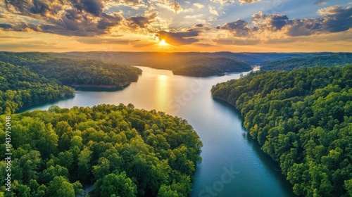 Breathtaking sunset view from a scenic drive overlooking a tranquil river surrounded by lush green hills