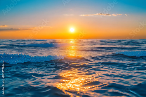 Ocean waves reflecting golden sunset light at dusk photo