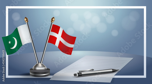 Pakistan and Denmark National flags on small table with bokeh background, cooperative relationship