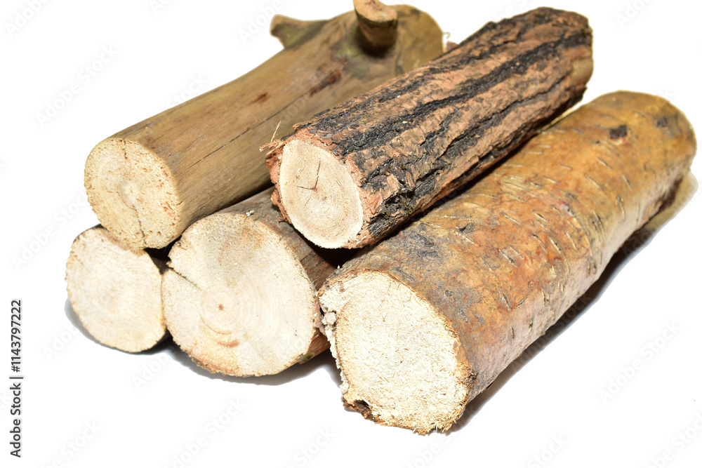 A stack of coniferous firewood, side view, lies on a white background. A stack of coniferous firewood, side view, lies on a white background.