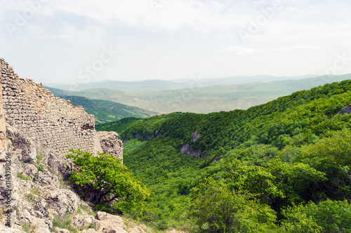 The remains of the ancient Chirag Gala fortress on top of a mountain in Azerbaijan photo