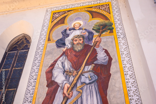 Quadro su tela Saint christopher carrying child jesus mural painting in kranj, slovenia
