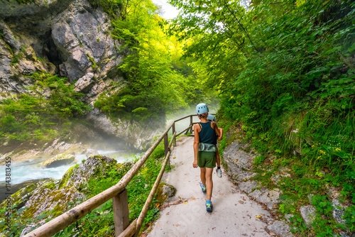 Family hiking in vintgar gorge near bled, slovenia, during summer