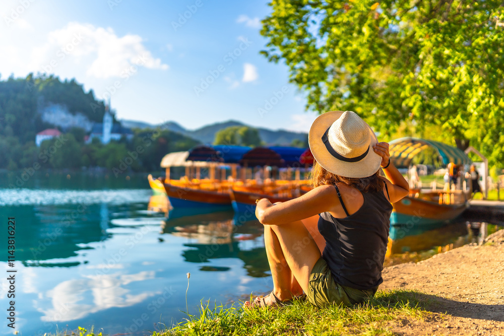 Fototapeta premium Tourist enjoying summer vacation at lake bled, slovenia