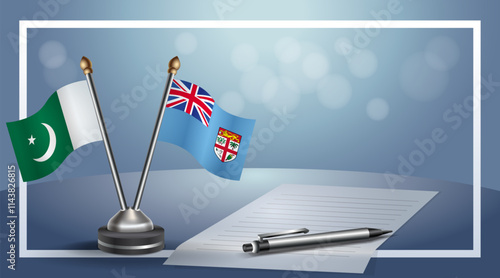 Pakistan and Fiji National flags on small table with bokeh background, cooperative relationship