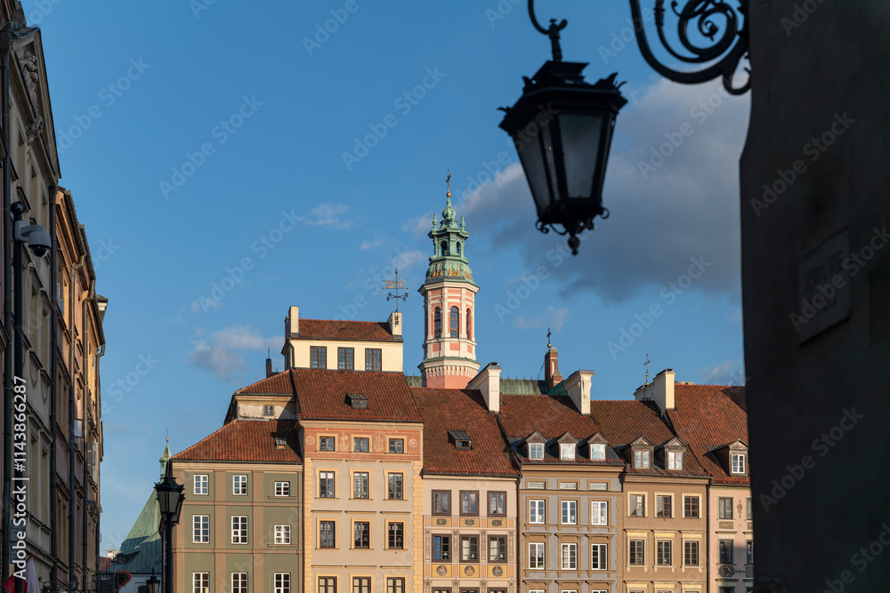 Low angle view of bell tower amidst buildings in town
