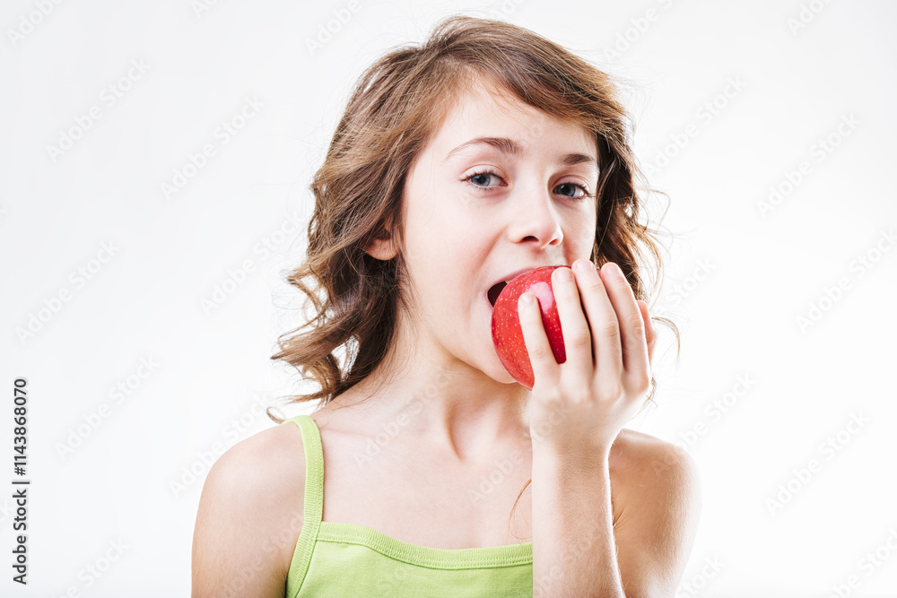 Young girl biting a red apple on white background Young girl biting a red apple on white background