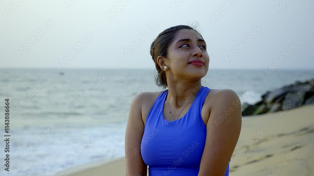 Young attractive Asian girl practice yoga pose on the beach. Confident fit women practicing meditation ,Concept of well being, healthy balanced lifestyle. Young attractive Asian girl practice yoga pose on the beach. Confident fit women practicing meditation ,Concept of well being, healthy balanced lifestyle.