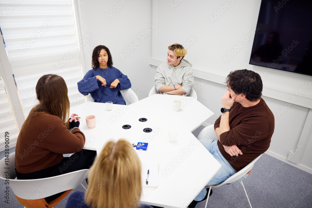 Medical students talking with managers during interview in office Medical students talking with managers during interview in office