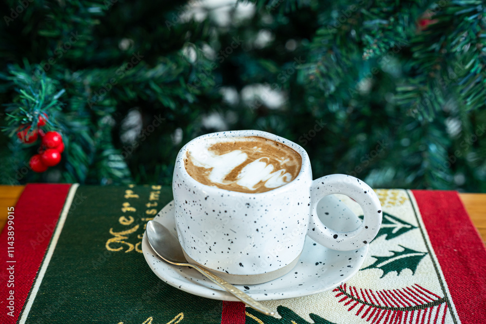 Close up of Hot coffee latte with latte art milk foam in cup mug with Xmas decors and Xmas tree baubles on wood desk Celebrating Merry Christmas and New year,Merry x-mas