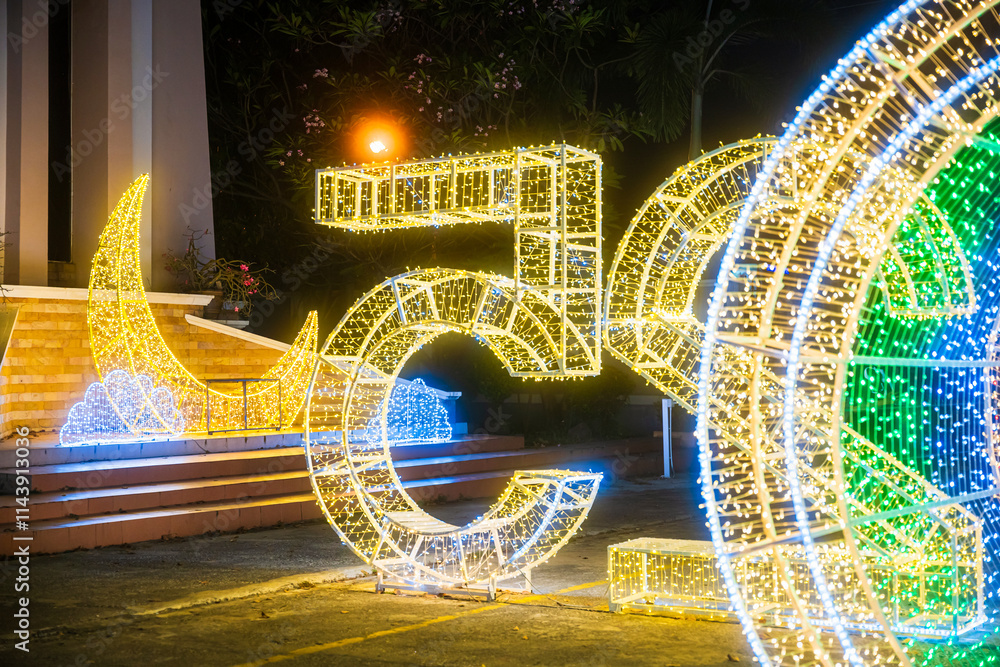 PHITSANULOK, THAILAND - December 15,2024:Decoration lights Christmas tree for celebrate Christmas and New Year Festival 2025 illumination at Saint Nicholas School in Phitsanulok City at night