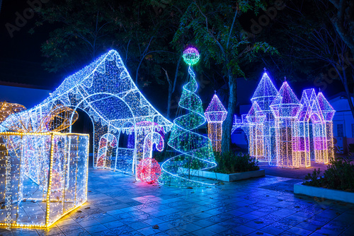 PHITSANULOK, THAILAND - December 15,2024:Decoration lights Christmas tree for celebrate Christmas and New Year Festival 2025 illumination at Saint Nicholas School in Phitsanulok City at night
