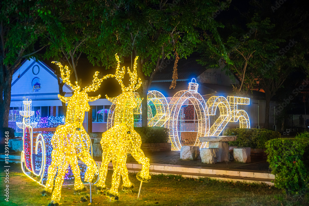PHITSANULOK, THAILAND - December 15,2024:Decoration lights Christmas tree for celebrate Christmas and New Year Festival 2025 illumination at Saint Nicholas School in Phitsanulok City at night
