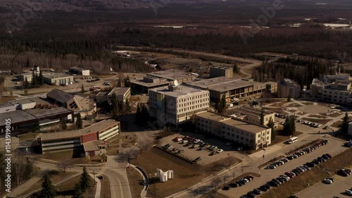 Aerial Wide Lift up of Gruening Building UAF Campus Springtime Fairbanks, Alaska photo