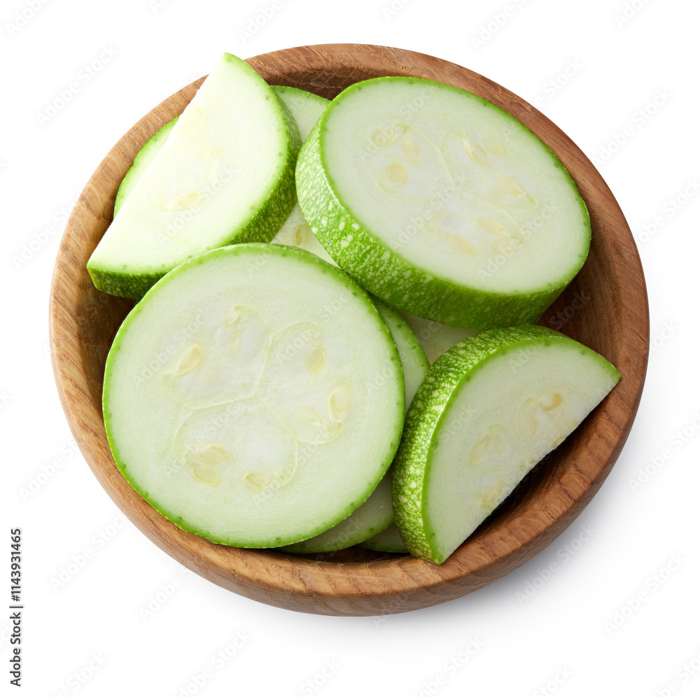 sliced zucchini or marrow in wooden bowl isolated on white background. clipping path sliced zucchini or marrow in wooden bowl isolated on white background. clipping path