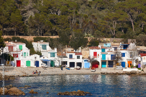 Picturesque colorful mediterranean shoreline in Girona. Salguer cove. Fisherman houses photo