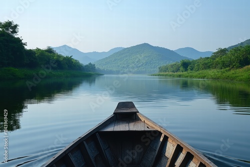 A small boat floating on a quiet river, surrounded by green hills and the gentle sound of water. photo