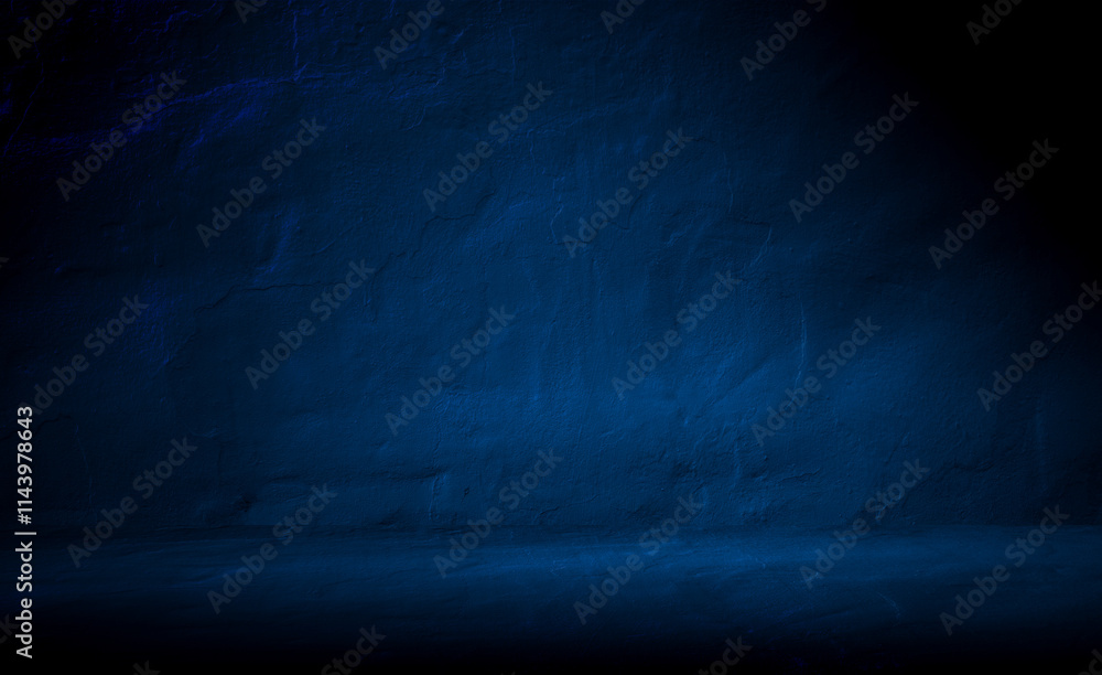 Dark concrete wall and floor background with blue lighting for mock up. Minimalist empty dark space with copy space. Three dimensional room backdrop for product display.