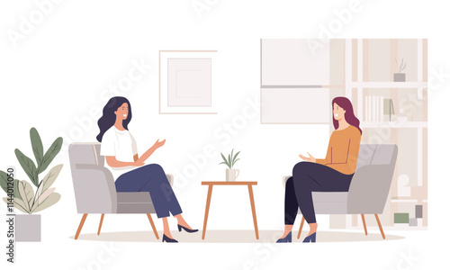 Two women sitting in chairs in a room