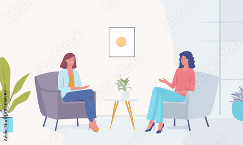 Two women sitting in chairs in a room